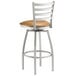 A Lancaster Table & Seating swivel restaurant bar stool with a light brown vinyl padded seat.