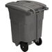 A grey Toter rectangular wheeled commercial trash can with a padlock lid.