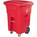 A red trash can with wheels.