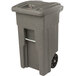 A grey Toter rectangular wheeled trash can with a barrel lock lid.