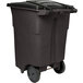 A brown Toter rectangular trash can with wheels.
