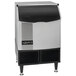 A Cornelius undercounter ice machine with a stainless steel finish and a black lid.