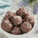 A bowl of Guittard La Premiere Etoile semi-sweet chocolate truffles.