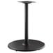 A black metal Lancaster Table & Seating Excalibur round table base with a round base.