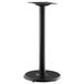 A black Lancaster Table & Seating Excalibur outdoor table stand with a round base.