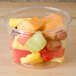 A clear Bare by Solo deli container filled with fruit on a table.