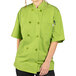 A woman wearing a lime green Uncommon Chef short sleeve chef coat with an avocado design.