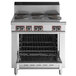 A stainless steel Garland electric restaurant range with six sealed burners and an oven.