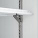 A metal shelf with a metal bracket attached to it.