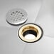 A Regency mop sink drain assembly with silver and gold finishes.