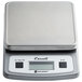 A grey San Jamar digital portion scale with a silver cover on the counter.