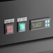 The digital display on a black Avantco GDC-12F-HC glass door freezer with green numbers.