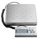 A silver San Jamar digital receiving scale with a cord attached to it.