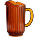 A brown plastic pitcher with a handle and 3 spouts.