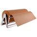 A roll of brown paper on a stainless steel Bulman paper cutter and dispenser.