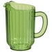 A green bamboo plastic beverage pitcher with a handle.