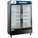 An Avantco black swing glass door merchandiser refrigerator with LED lighting and customizable panel.