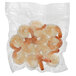 A close up of a white plastic bag of shrimp.
