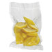 A close up of a bag of yellow fruit in a white Hamilton Beach vacuum seal pouch.