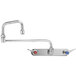 A T&S chrome wall mount workboard faucet with double jointed swing nozzles.