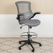 A Flash Furniture dark gray mesh office chair with a metal base and foot rest.