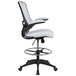 A white office chair with a black base and foot rest.
