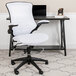 A Flash Furniture white mesh office chair with a black base.