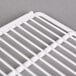 A close up of a white coated wire shelf for an Avantco merchandiser.