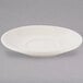 A Tuxton eggshell china saucer with a small rim on a white background.