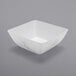 A white square bowl with a marble pattern.