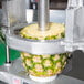A Nemco pineapple corer and peeler processing a pineapple.