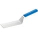 A metal spatula with a blue handle.