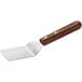 A metal spatula with a wooden Dexter-Russell rosewood handle.