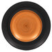 A close up of a RAK Porcelain Trinidad cedar and black porcelain plate with a spiral design in black and orange.