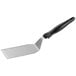 A Vollrath Jacob's Pride stainless steel turner with a black handle.