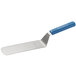 A Dexter-Russell Sani-Safe blue perforated turner with a blue polypropylene handle.