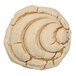 A cookie stamped with a spiral design using an Ateco Mexican bread stamp.