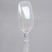 A 0.5 oz. clear plastic topping dispenser spoon with a handle.