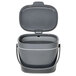 A charcoal gray OXO compost bin with a lid and handle.