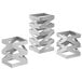 A group of three stainless steel rectangular risers with zig zag designs.