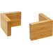 Two natural bamboo L-shaped risers on a table.
