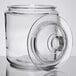 A Choice clear glass jar with glass lid on a table.