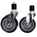 A pair of Advance Tabco heavy duty casters with black rubber wheels and black rubber bands.