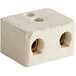 A white ceramic block with two holes.