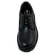 A close-up of a black Genuine Grip oxford shoe with laces and a rubber sole.