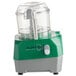 A clear AvaMix Revolution batch bowl food processor with a green and grey lid.