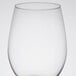 A close up of a clear Libbey wine glass.