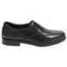 A black Genuine Grip men's slip-on dress shoe with a rubber sole.