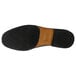 The brown sole of a Genuine Grip men's black slip-on dress shoe.