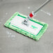 A Unger window cleaning kit with a green mop.